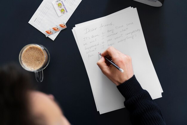 Top view man writing letter