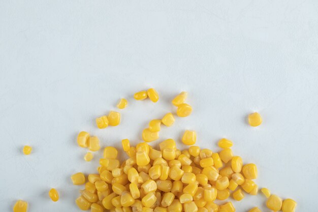 Top view. marinated corn seeds on white background.