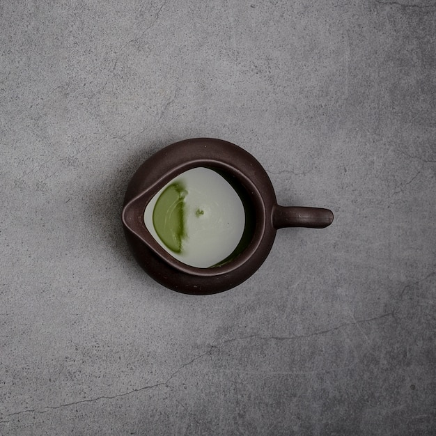 Top view of matcha tea in pourer