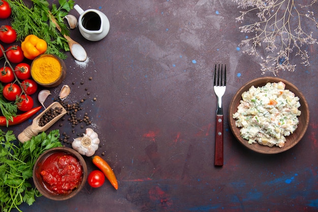 Top view mayyonaise salad with greens and vegetables on dark desk