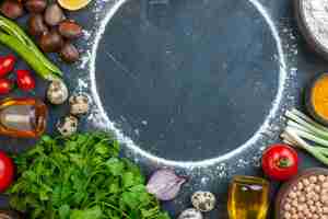 Free photo top view of meal cooking with eggs fresh vegetables spices eggs fallen oil bottle green bundles fallen oil