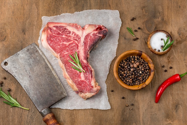 Top view of meat with spices and chili