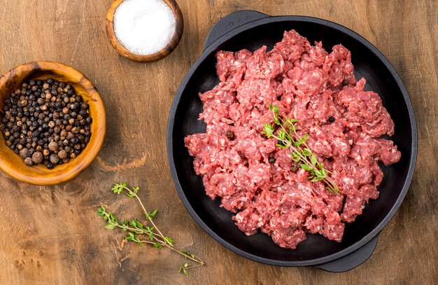 Top view of meat with spices and herbs