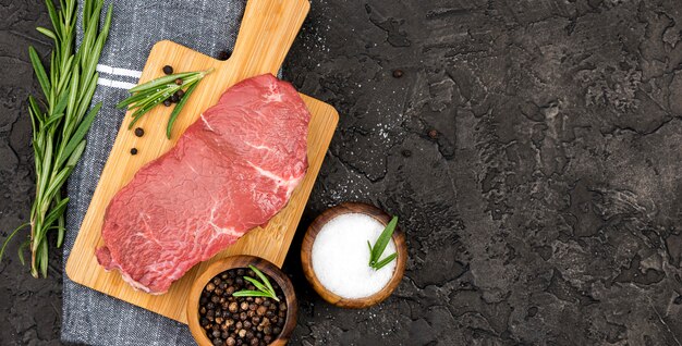 Top view of meat with spices and herbs