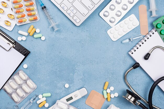 Top view medical elements composition on blue cement background