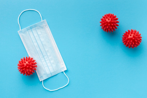 Top view of medical mask with viruses