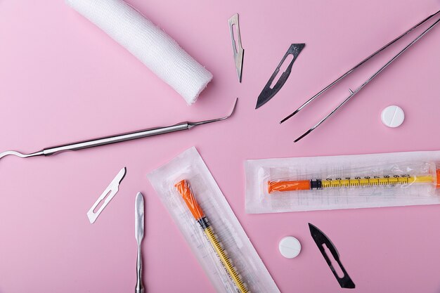 Top view of medical scalpel with other instruments for medicine