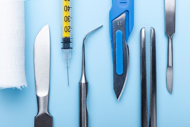 Top view of medical scalpel with other instruments for medicine