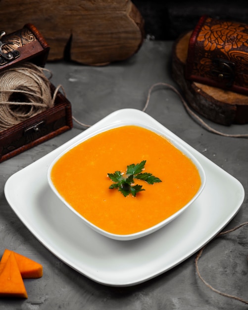 Top view of merci soup with greens in the bowl