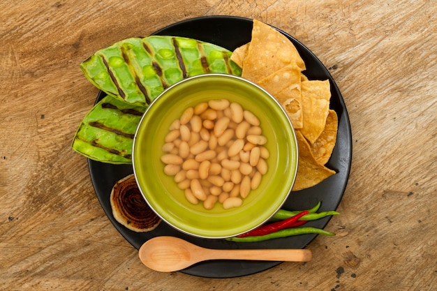 Top view mexican dish with wooden background