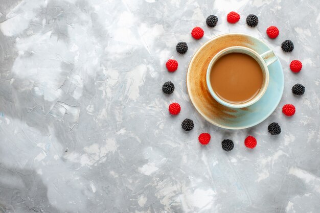 Top view milk coffee with berries on the light background drink coffee cocoa berry fruit confiture