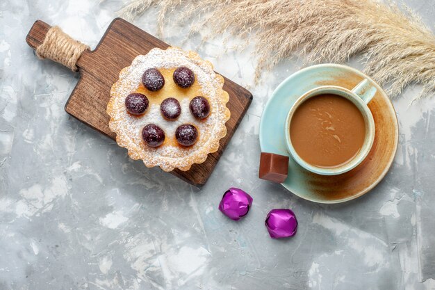 Top view milk coffee with cherry cake on the grey-whtie desk cake sweet sugar bake color