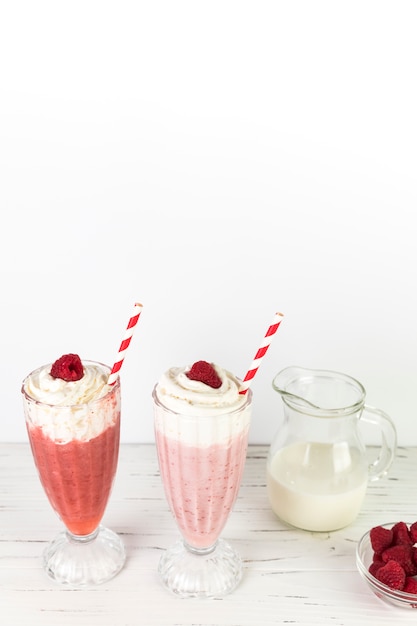 Top view milkshake glasses with whipped cream