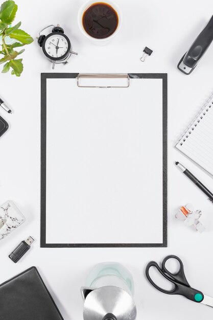 Top view minimalist business arrangement with empty clipboard