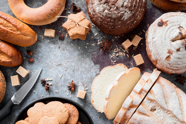 Top view mix of breads and cookies with brown sugar cubes