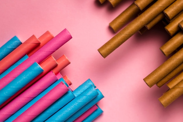 Top view mix of colorful straws on table