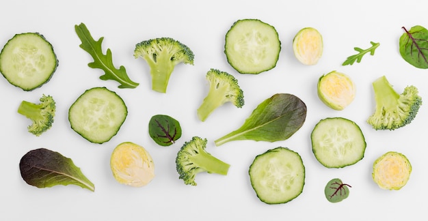 Top view mix of salad leaves and cucumber slices