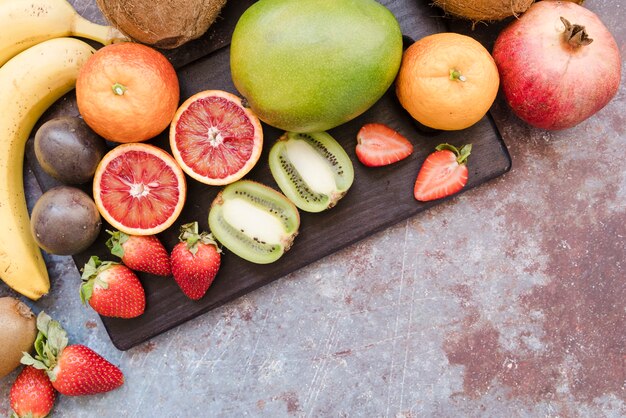 Top view mixture of exotic fruits ready to be served