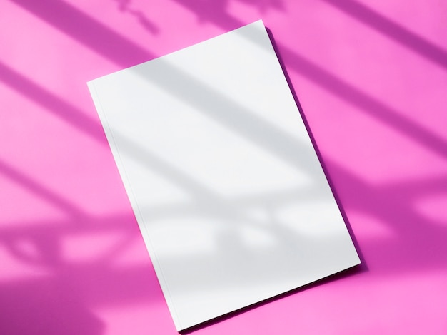 Top view mock-up magazine with pink background