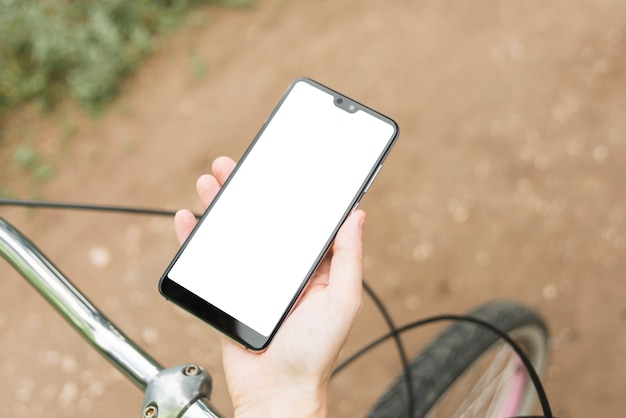 Free photo top view mockup smartphone with defocused bicycle