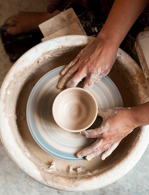 Top view modeling in clay on a potter's wheel