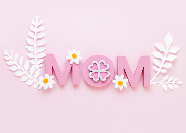 Top view mom word on pink background