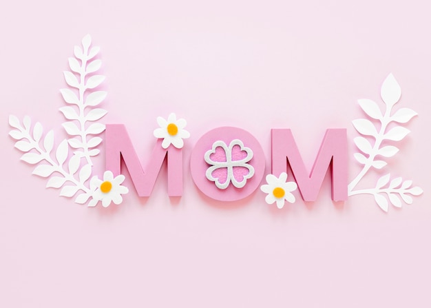Top view mom word on pink background
