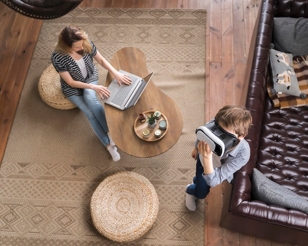 Top view mother working from home