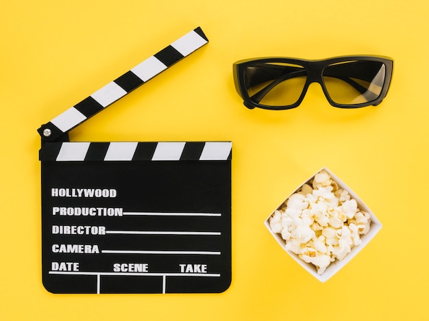 Top view movie clapperboard with 3d glasses