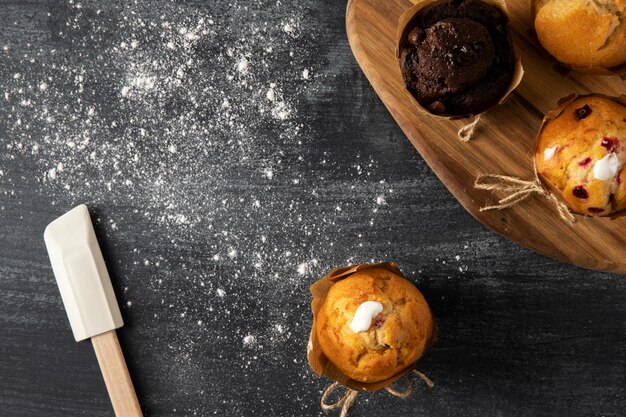 Top view of muffins on dark marble surface