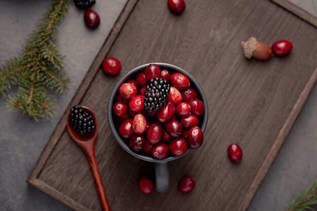 Top view of mug with cranberries and blackberries