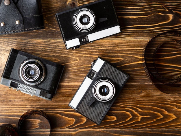 Free photo top view of multiple retro photo cameras