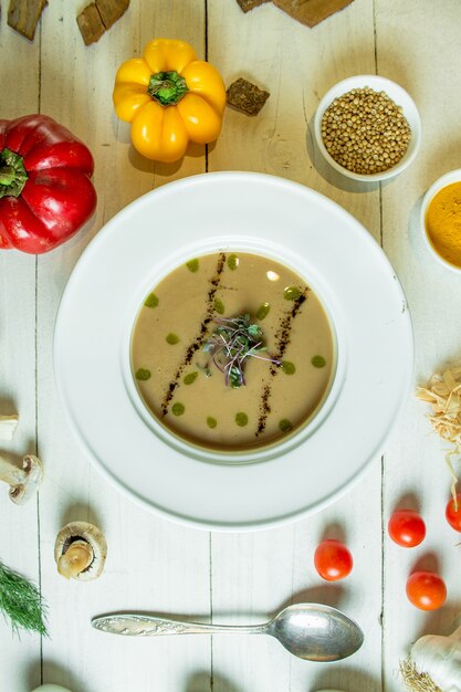 Top view of mushroom cream soup in a white bowl