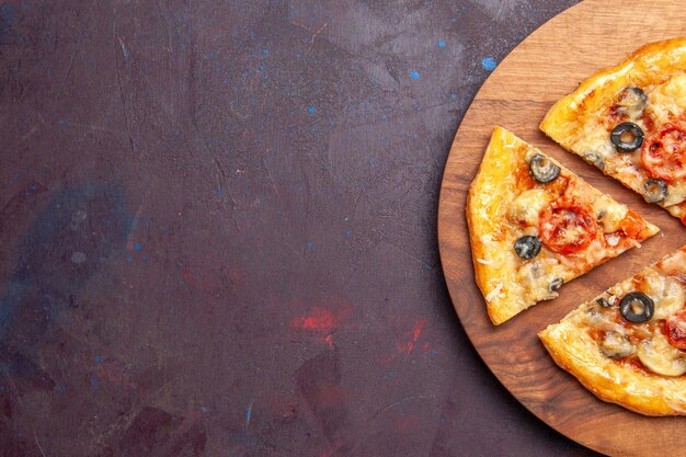 Top view mushroom pizza sliced cooked dough with cheese and olives on a dark surface food italian meal pizza dough