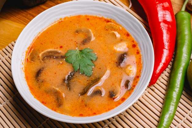 Top view mushroom soup with mushrooms and hot pepper