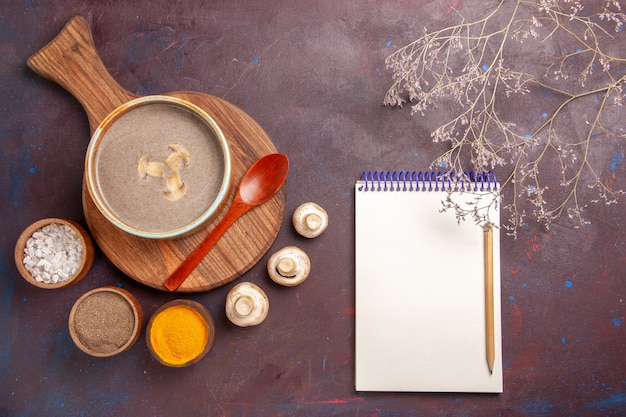 Free photo top view mushroom soup with seasonings on the dark space