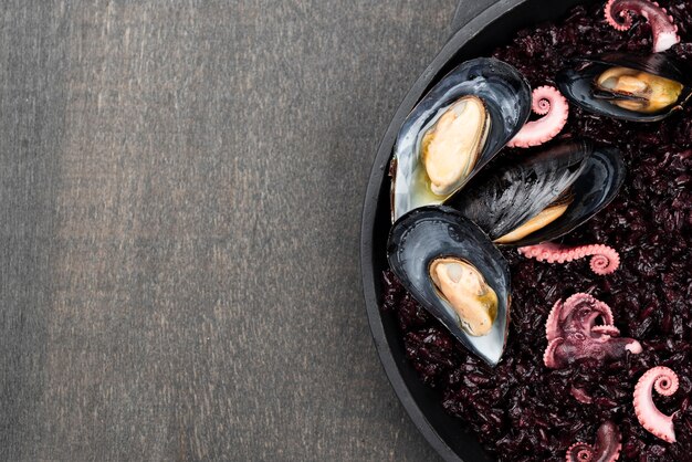 Top view of mussels with squid and copy space