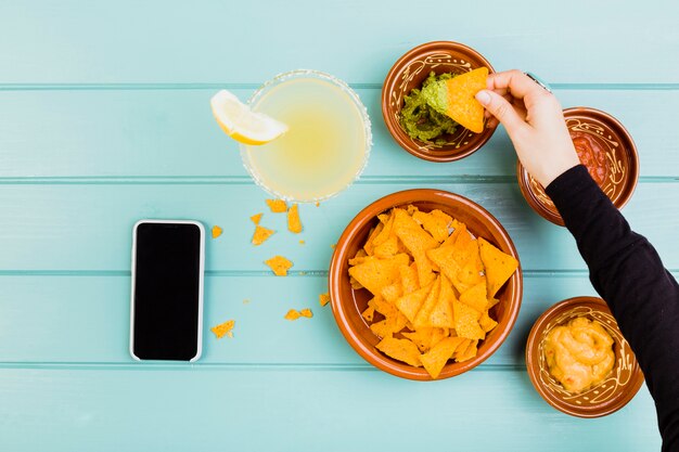 Top view of nachos and guacamole