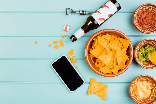 Free photo top view of nachos and guacamole