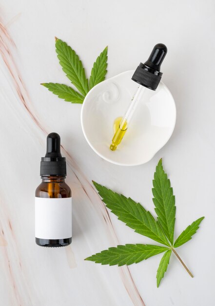 Free photo top view natural cannabis oil bottle assortment