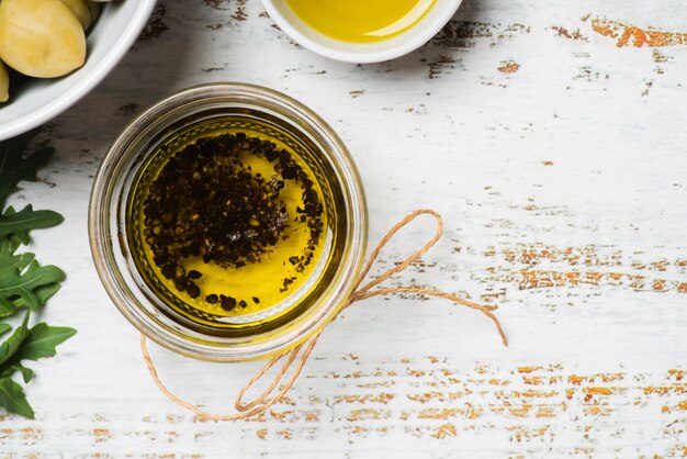 Top view natural olive oil in a bowl