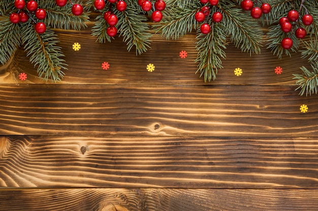 Free photo top view natural pine needles with red flowers and stars