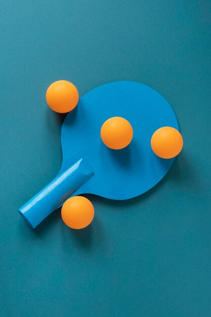 Top view of new ping pong paddle with balls