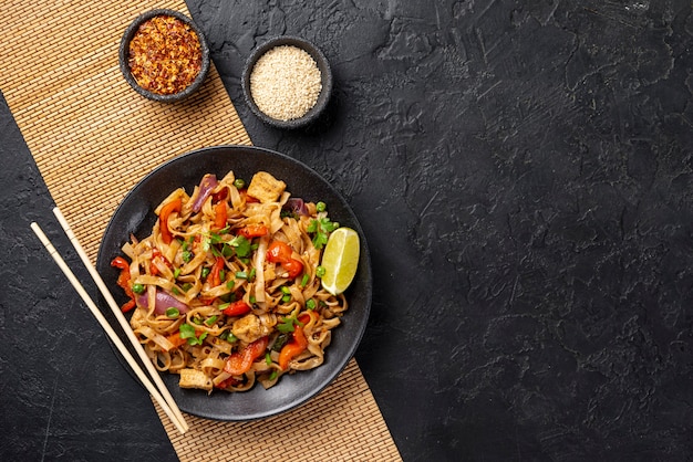 Premium Photo | Top view noodles with vegetables and chicken with copy space