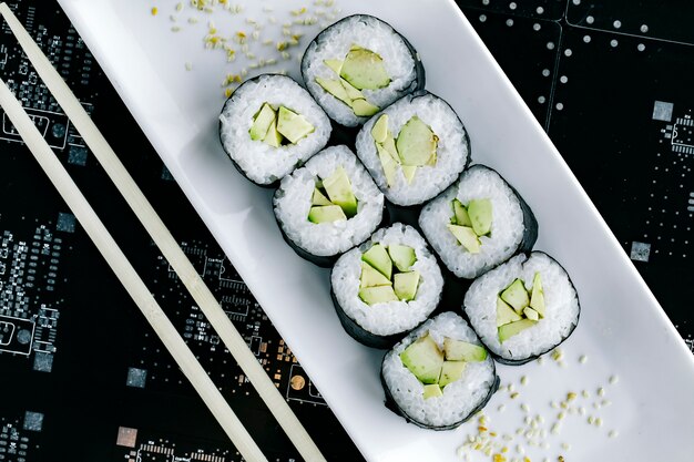 Top view of nori sushi rolls with avocado