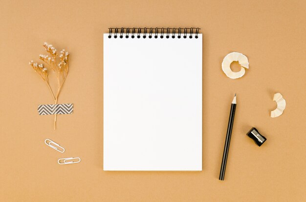 Top view of notebook on desk with pencil