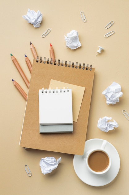 Top view of notebook for house renovation with colored pencils