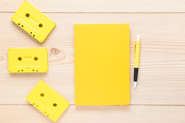 Top view notebook with audio cassettes