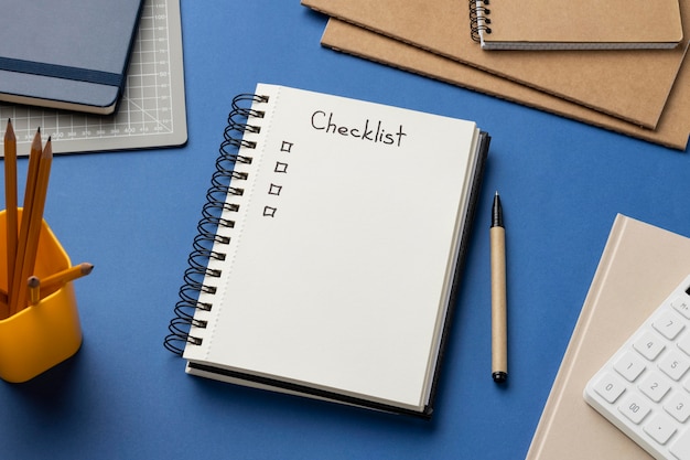 Top view notebook with checklist on desk