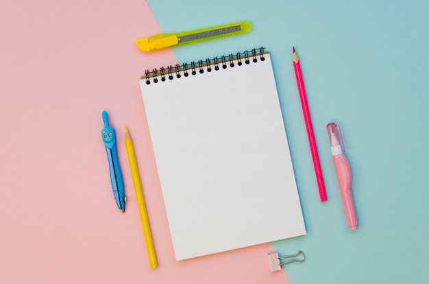 Top view of notebook with colorful pens